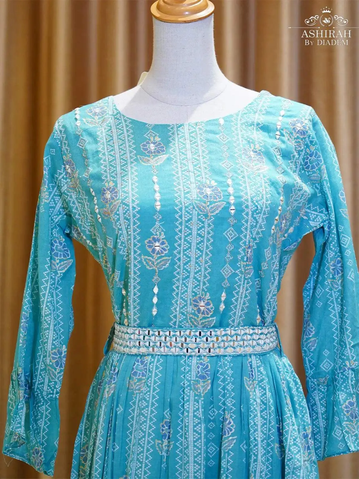 Cyan Blue Long Kurti Adorned with Prints and Thread work along with Waist Belt