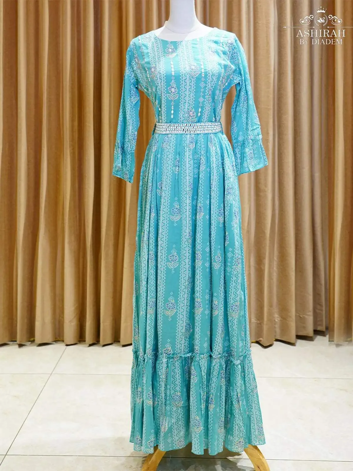 Cyan Blue Long Kurti Adorned with Prints and Thread work along with Waist Belt